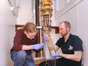 The experiment is at about a 10000th of a degree above absolute zero in a special refrigerator ; Dr Autti (right)

 

CREDIT
Lancaster University