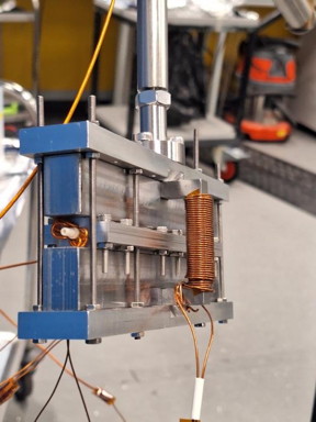 A close-up of the magnetic encoding device before it was attached. The atomic beam enters the device through the hollow white ceramic tube shown.

Credit
Morgan Lowe, a PhD student in the Swansea team.